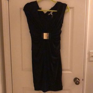 Black Jennifer Lopez dress with gold buckle